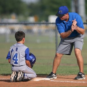 Kid and Coach at Little League